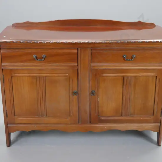 reproduction mahogany sideboard with 2 baize lined drawers, one partitioned, 2 panelled doors w/metal drop handles -