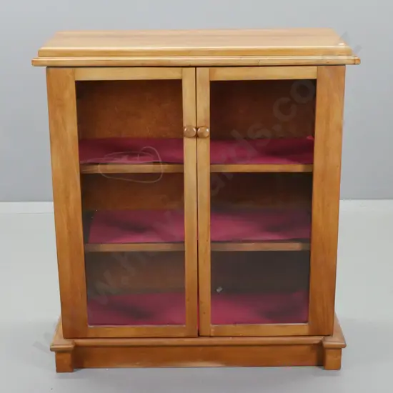 vintage rimu and beech 2-door display case with 2 adjustable shelves, timber knobs, on plinth base. Some staining to top