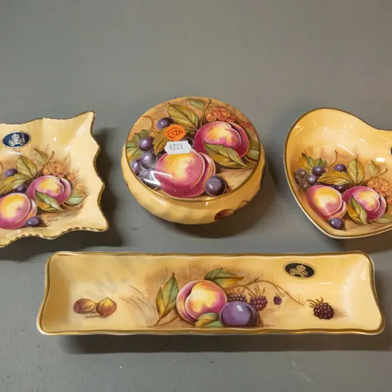 4 pieces of Aynsley china - lidded canister and 3 dishes - three are signed, long dish is L-210