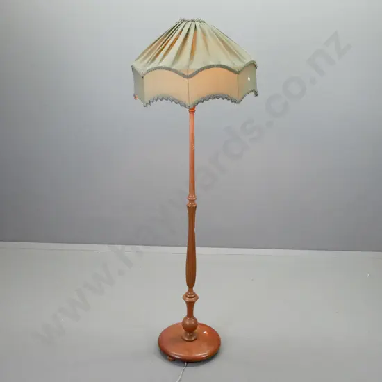 vintage mahogany standard lamp with fluted turned column, circular base 3 bun feet, shaped and pleated green fabric