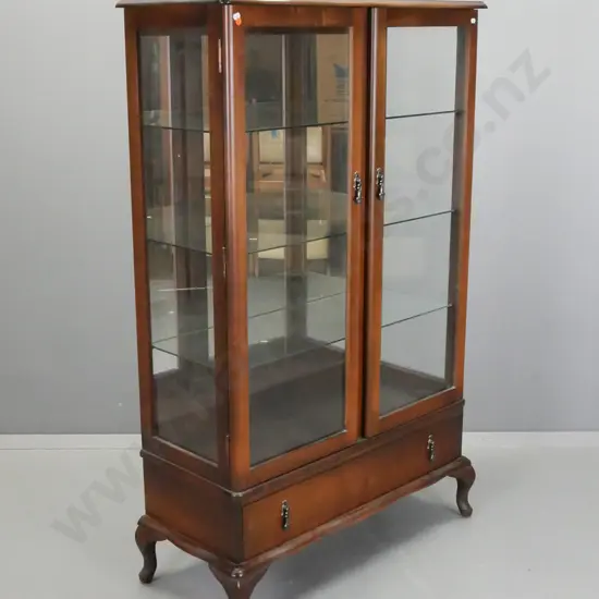 reproduction 2 door mirrored back display case with glazed sides, 3 glass shelves, bottom drawer, shaped front, on short