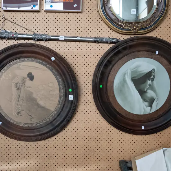 2 round timber framed prints - woman on beach, mother on child - some water damage