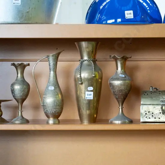 shelf of brassware