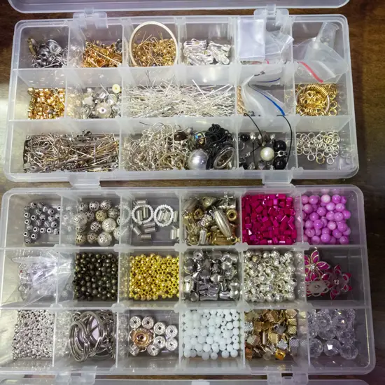 2 plastic organisers of various beads and jewellery making supplies