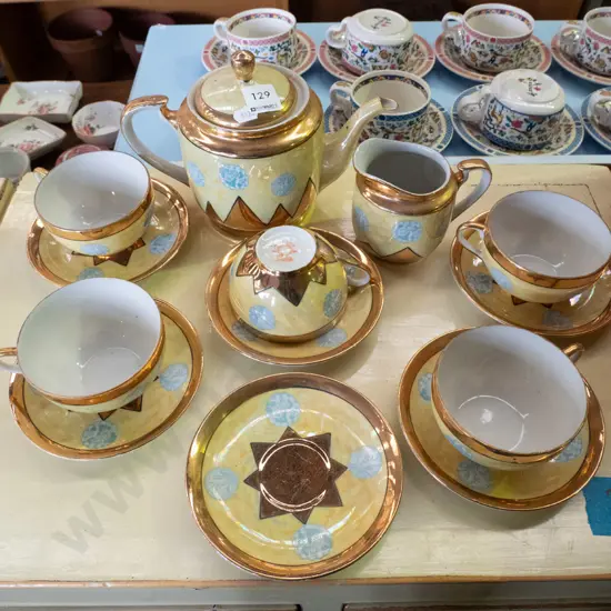 teapot, cream jug, cups & saucers