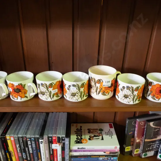 6 Meakin coffee cups and one Australian poppy coffee cup