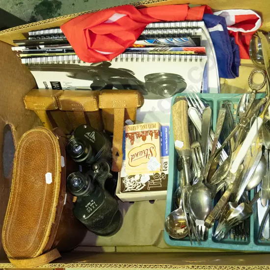 box of binoculars, music books, cutlery, playing cards, etc.