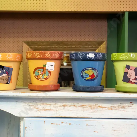 4 Winnie the Pooh planters, one missing tray