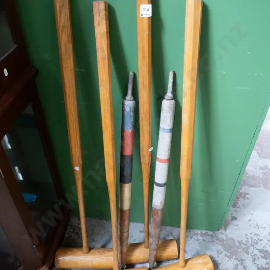 4 croquet mallets and 2 scoring wickets