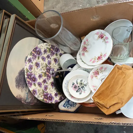 box of prints, clutch purse, plates, glass vase, etc.