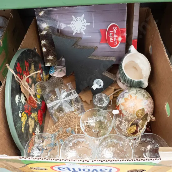 box of Christmas decorations and glasses