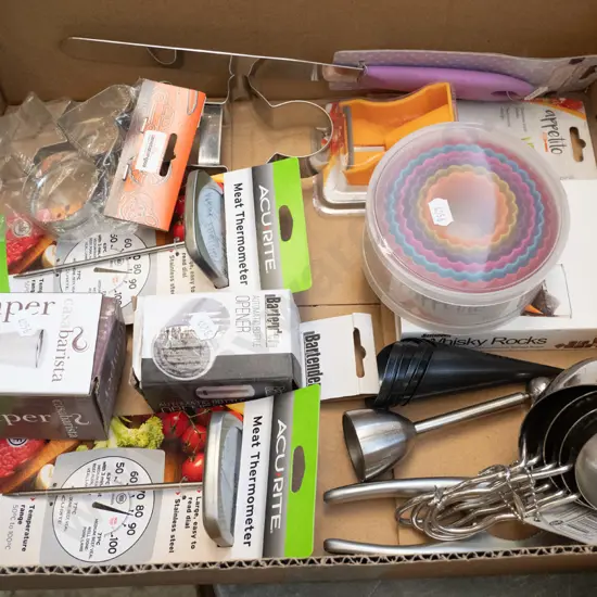 box of as-new kitchen items - cookie cutters, meat thermometer, whisky rocks, measuring cup, etc.