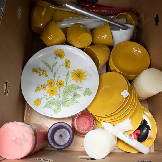 box of plastic retro picnic ware and candles