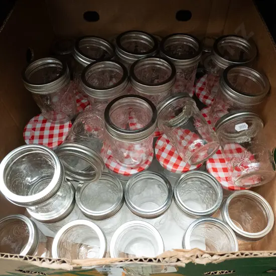 box of preserving jars, some with lids