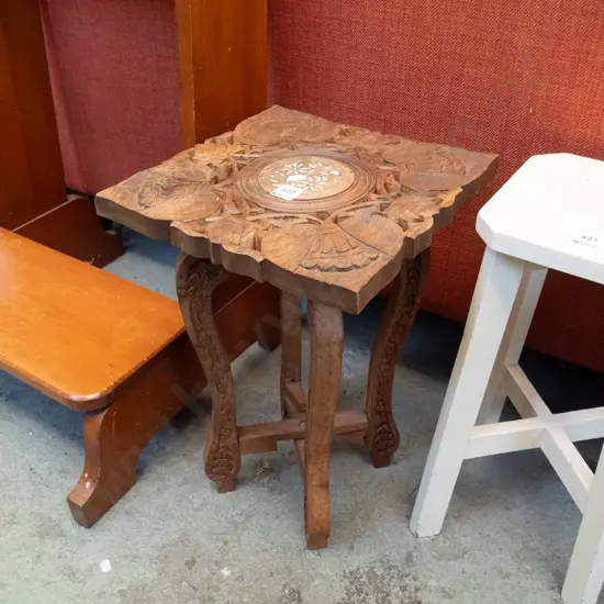 carved wooden end table