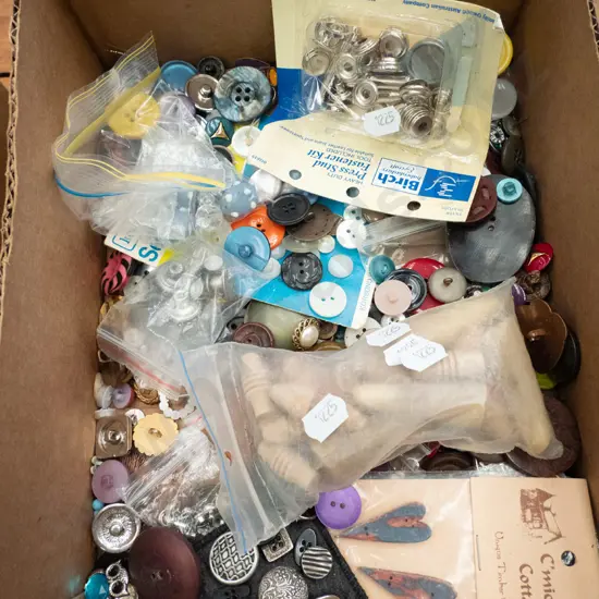 box of buttons and fasteners