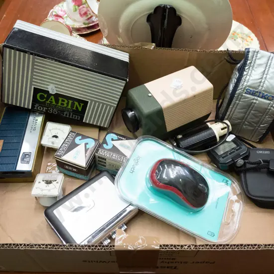 slide projector, stop watch, light meter, portable cassette player, etc.