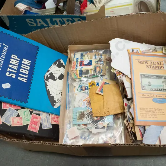box of stamps and stamp albums