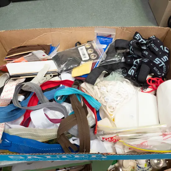 box of zips, binding, other sewing supplies