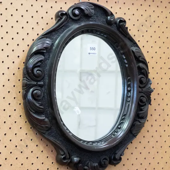 small ornate carved Victorian wall mirror