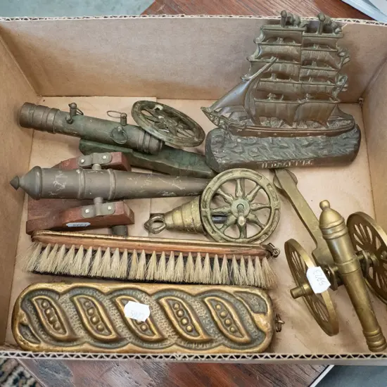 box; ornamental brass canons, clothes brushes etc