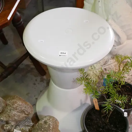 white plastic shower stool