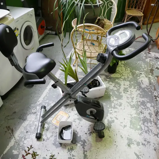 X-bike exercycle, small plastic container of accessories