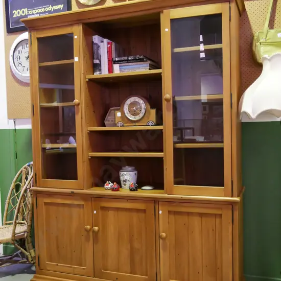 solid rimu wall unit with 2 glazed display doors and 3 solid doors with internal adjustable shelving