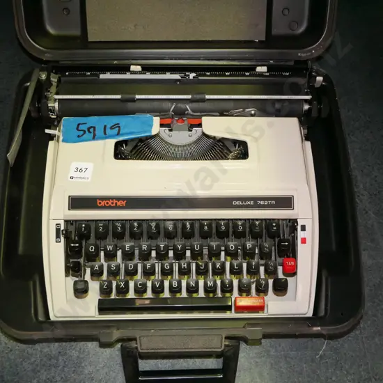 Brother typewriter in hard plastic carry case