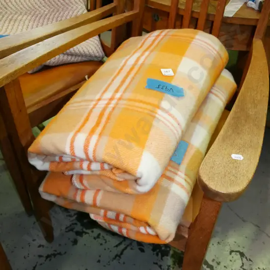 2x white and orange checked woollen blankets