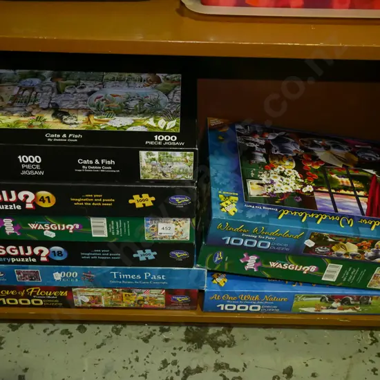 shelf of wasgij and other puzzles