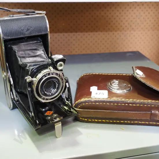 leather cased concertina camera