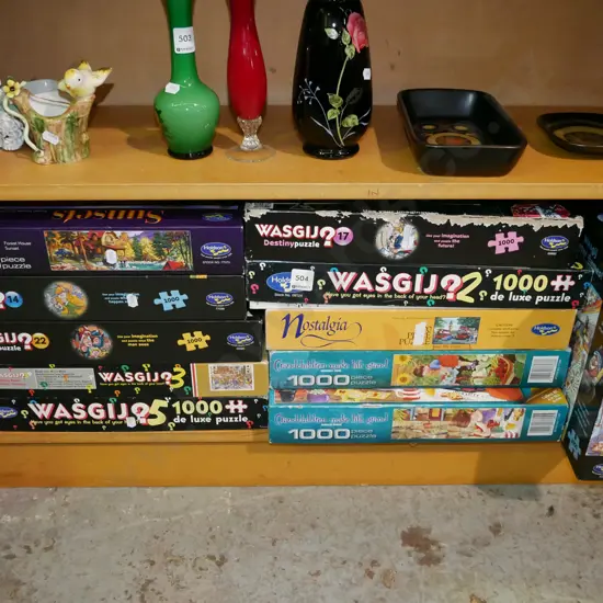 shelf of wasgij and other puzzles