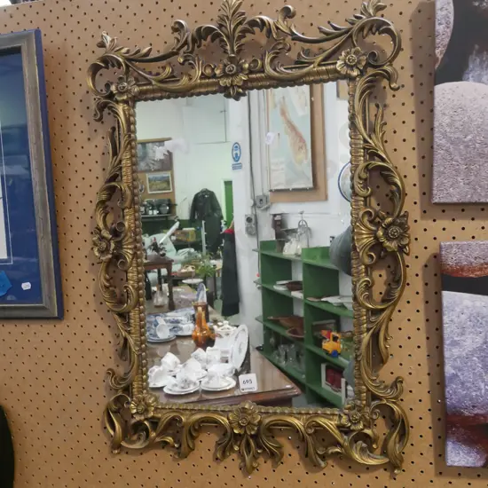 ornate gilt framed wall mirror