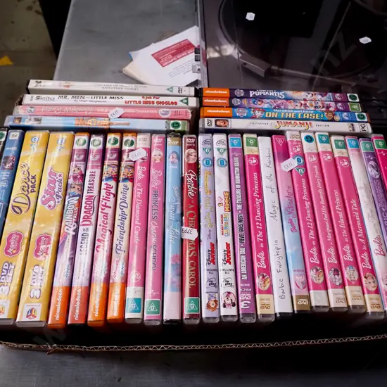 box of Barbie and other DVDs