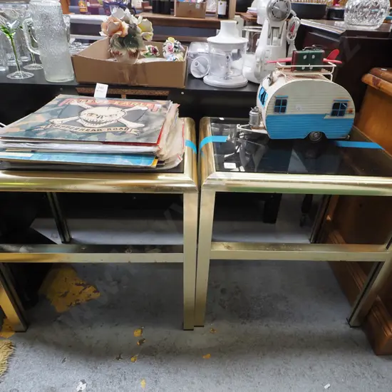 pair of brass and smoked glass end tables