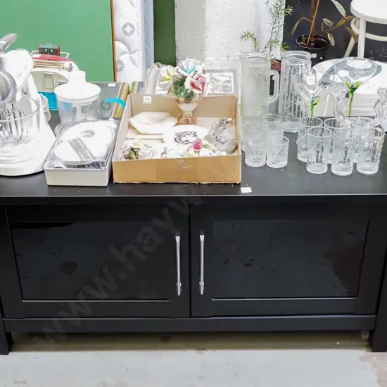 black melteca 2 door cupboard H-560 W-1210 D-500