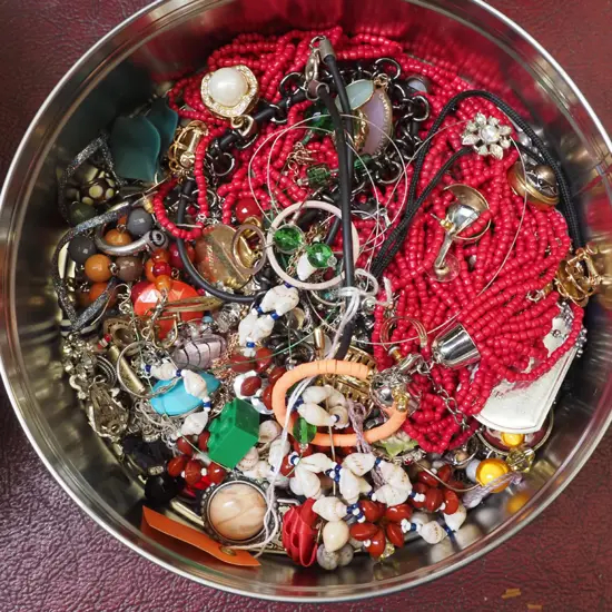 tin of costume jewellery