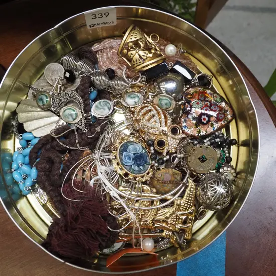 tin of costume jewellery