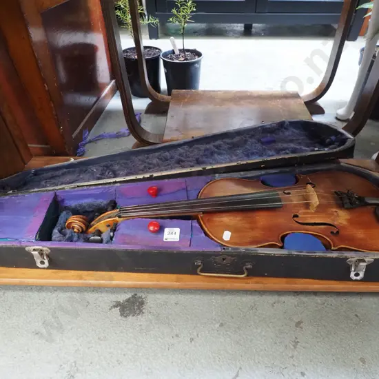 old violin in case with bow