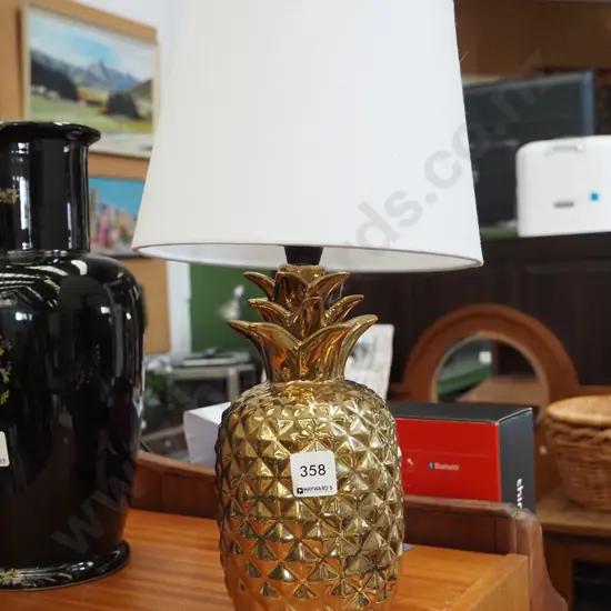 golden pineapple based table lamp
