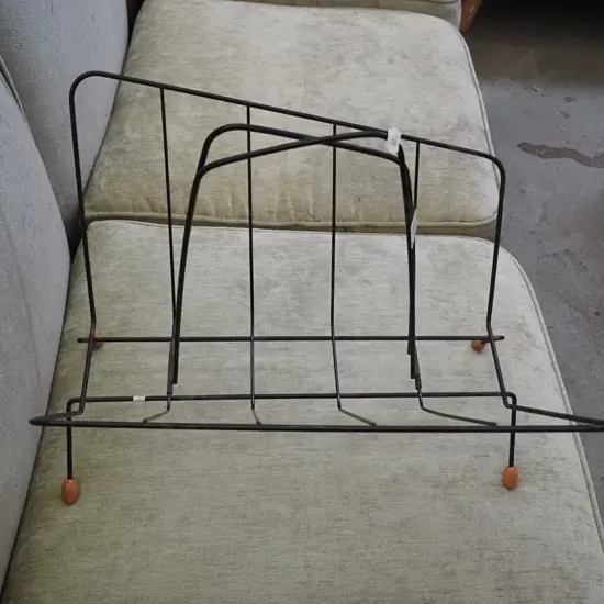 bent metal retro magazine rack