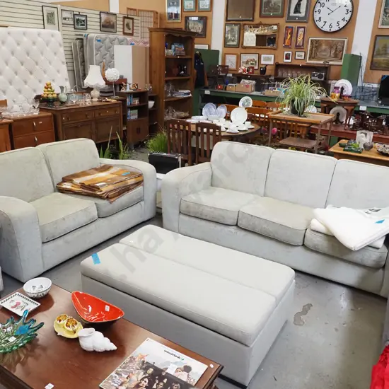 light green 2 piece suite - 3 seater and 2 seater - some fading and staining