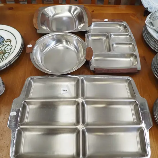 assorted stainless steel and wood serving bowls