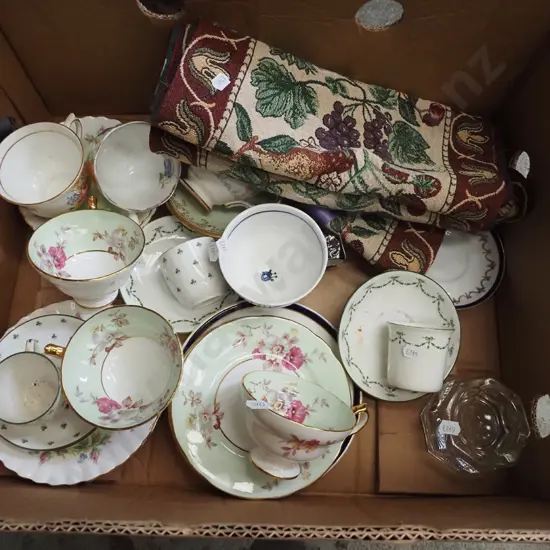 box; various cups, saucers, table runner