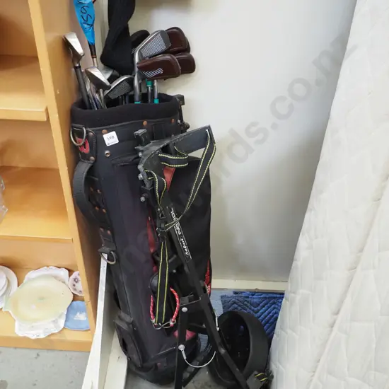 golf clubs and trundler