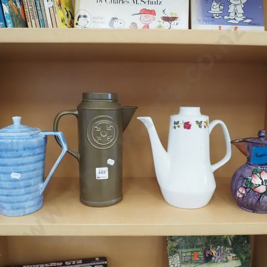 shelf of coffee and tea pots