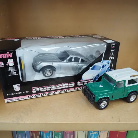 die cast model of Landrover, radio controlled Porsche
