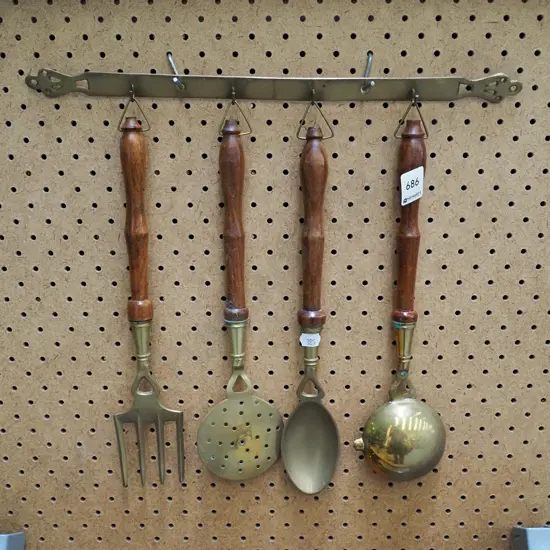 brass and wood kitchen utensils