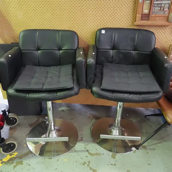 pair of black vinyl and chrome bar stools- vinyl needs attention